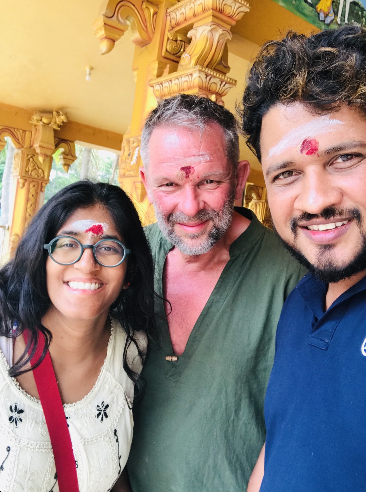 Nishan and travellers during a temple visit
