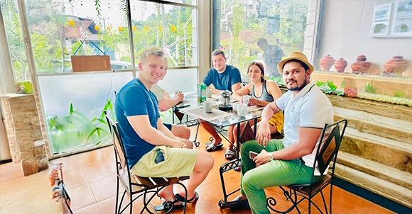 Nishan relaxing with travellers at a cafe